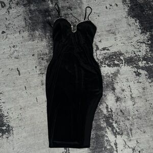 Stretchy black velvet dress with slits on the side and rhinestone neckline